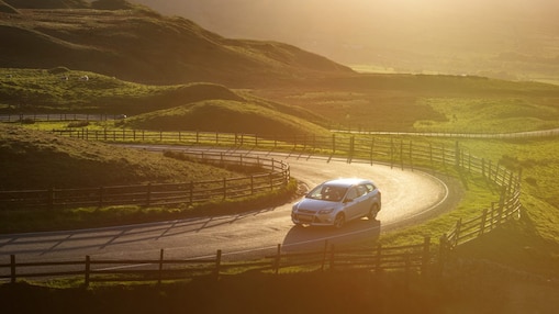 Car driving in the green field