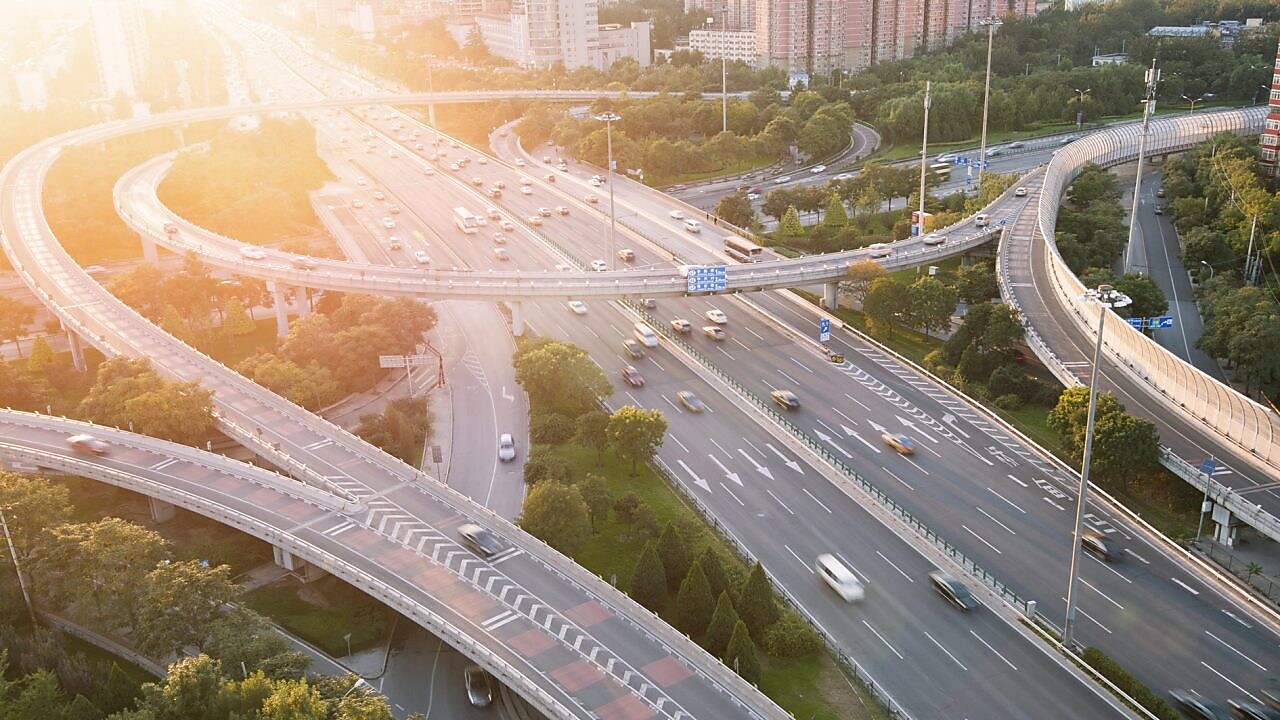 Cars driving on a complicated highway infrastructure with over and under passes