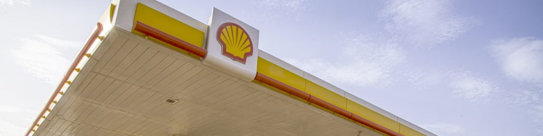 The forecourt of a shell service station at dusk