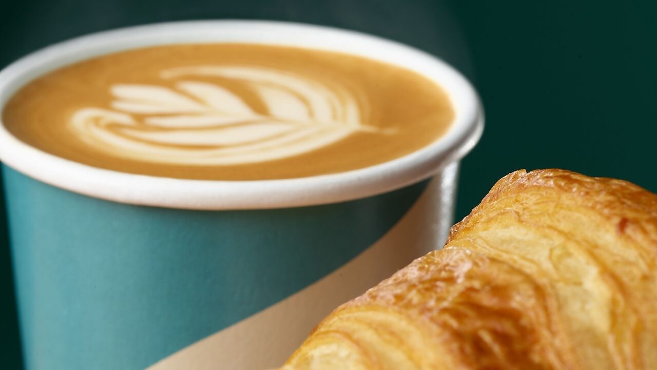 Female Barista serving a customer