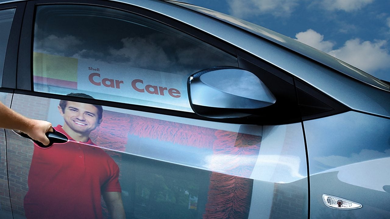 reflection of a man on the car