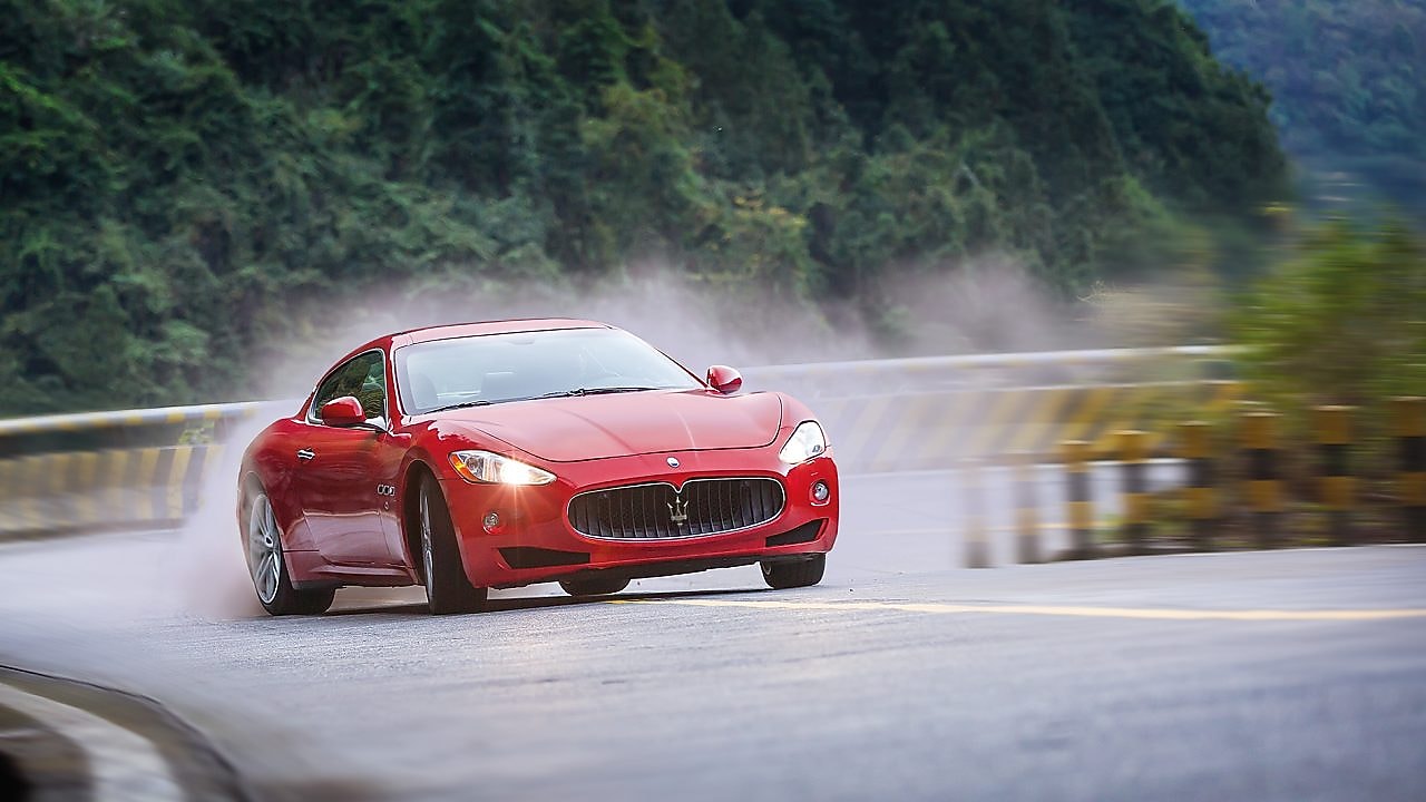 A red Maserati speeds uphill in the Shell Helix Ultra film We Know Why You Drive