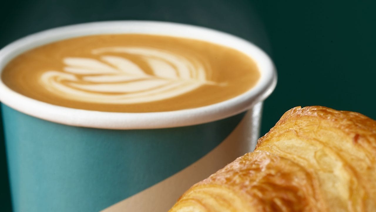 Female Barista serving a customer