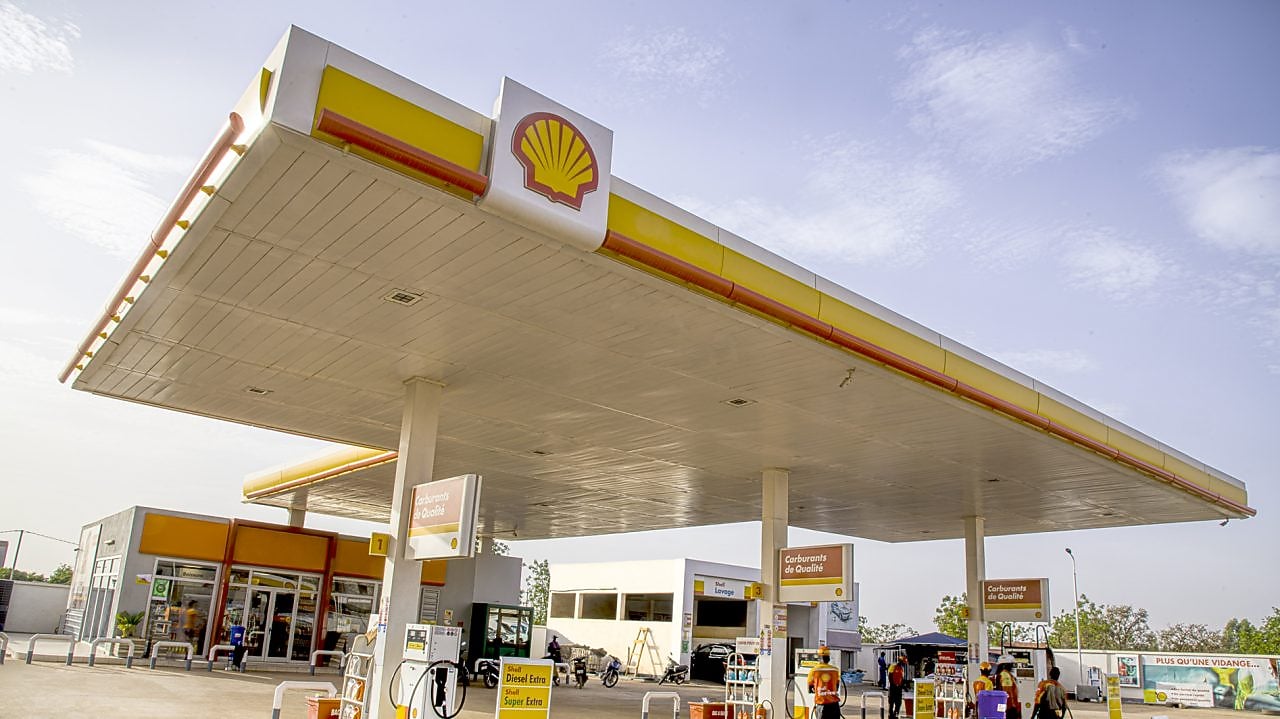 The forecourt of a shell service station at dusk