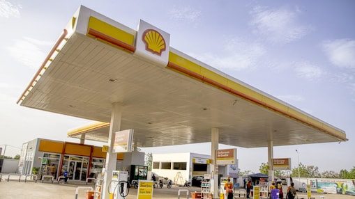 The forecourt of a shell service station at dusk