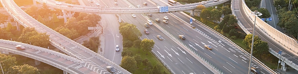 Cars driving on a complicated highway infrastructure with over and under passes