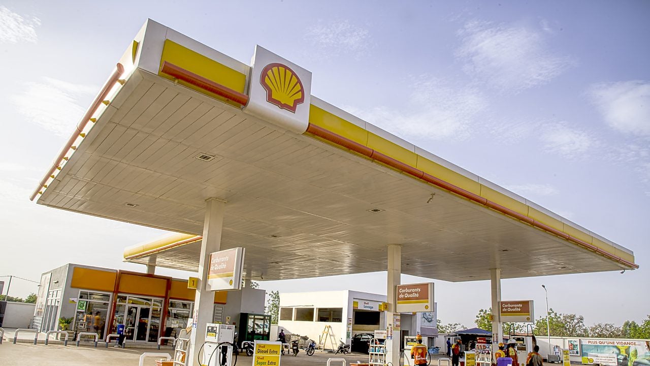 The forecourt of a shell service station at dusk