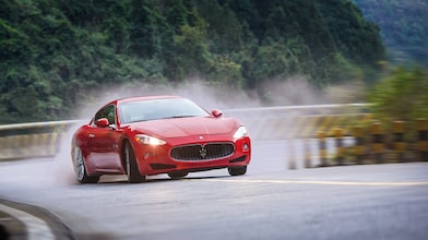 A red Maserati speeds uphill in the Shell Helix Ultra film We Know Why You Drive